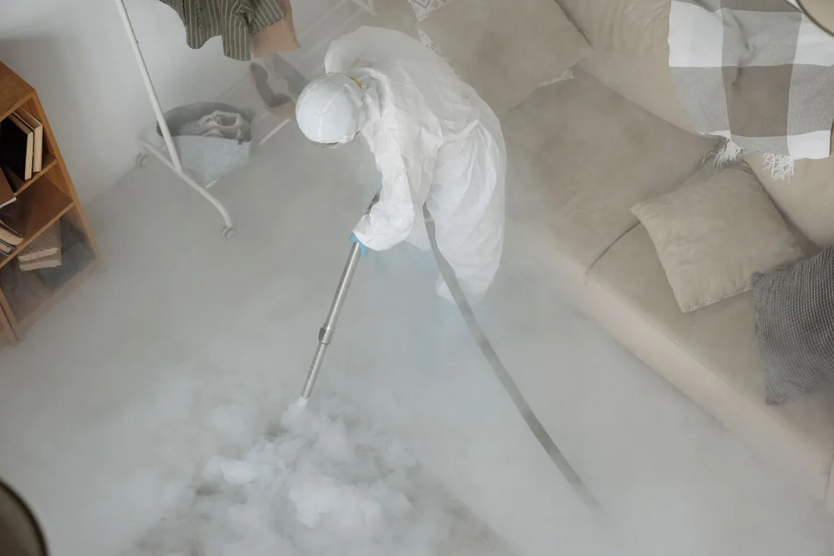 Biohazard cleanup technician in protective equipment, Beaverton, MI